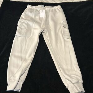 Brand new cream coloured Nike joggers tags still on.
